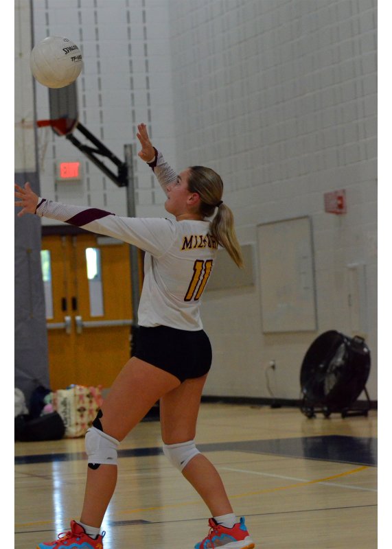 Milford eighth-grader Natalie Smith serves up an ace to give the Bucs the JV win.